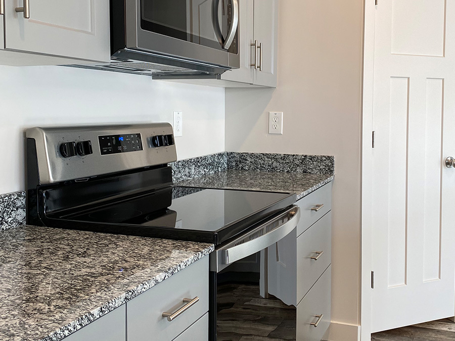 grey classic painted cabinetry with sparkle white granite